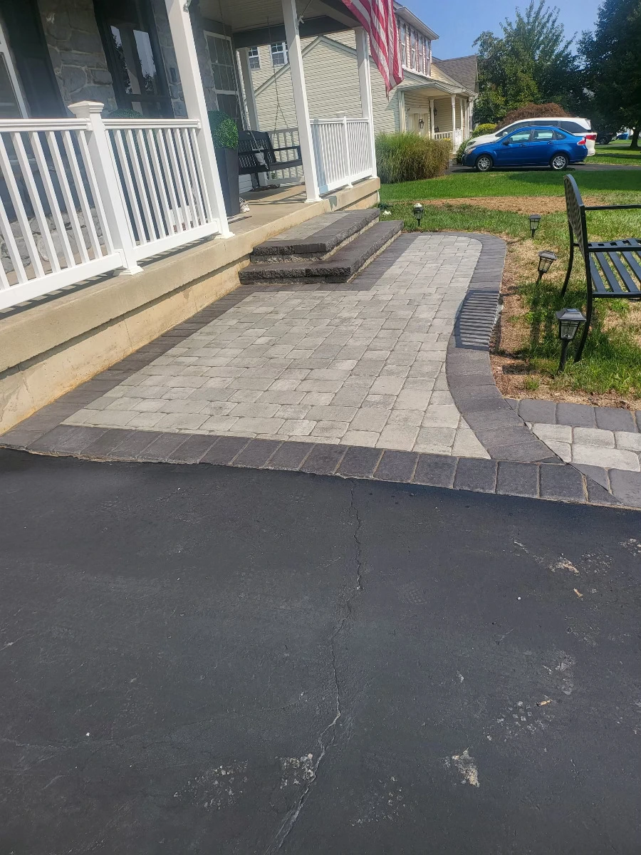A hardscaping project with brand new outdoor flooring for the front of the house