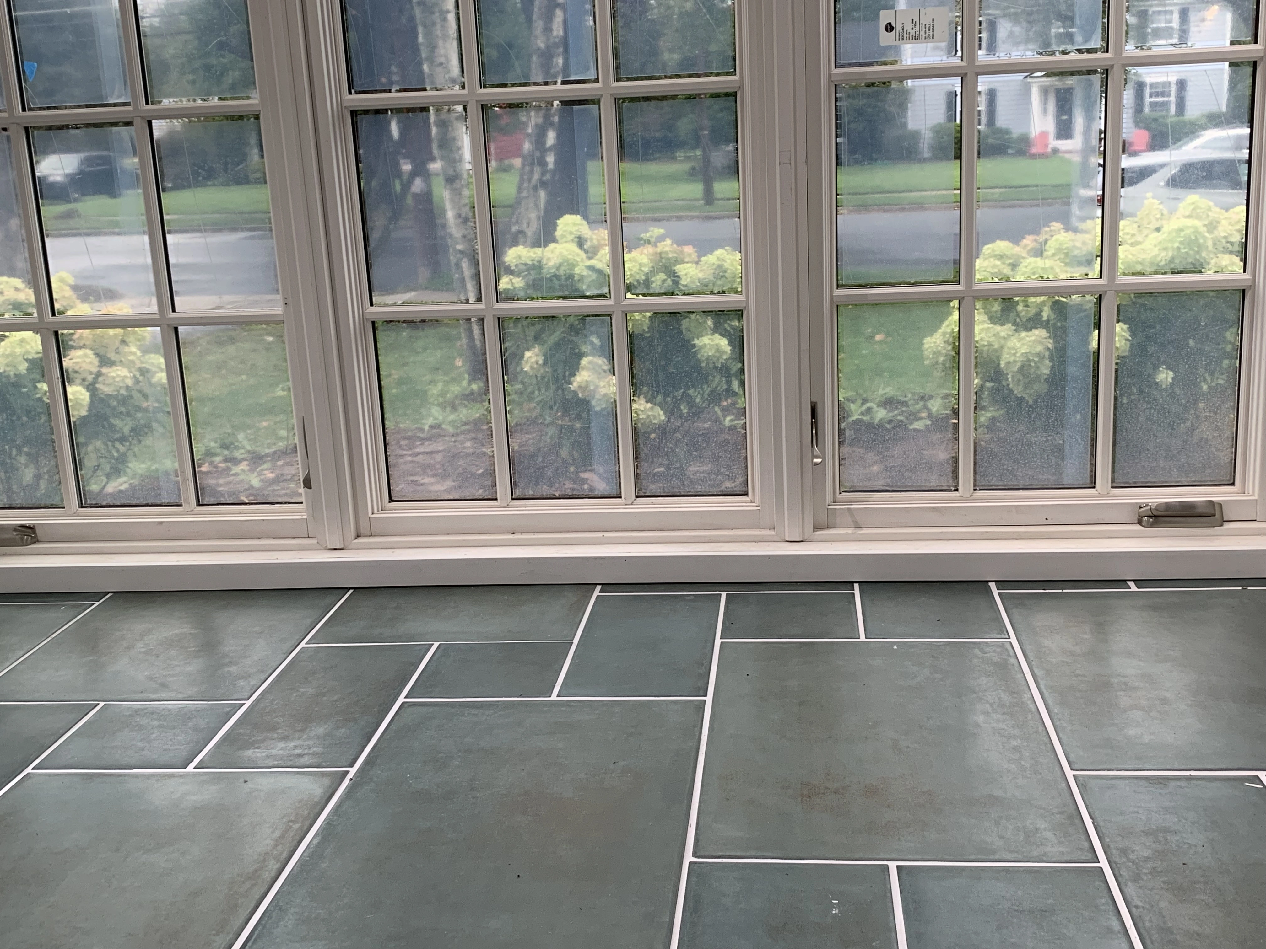 A sunroom renovation from the inside with new tile flooring