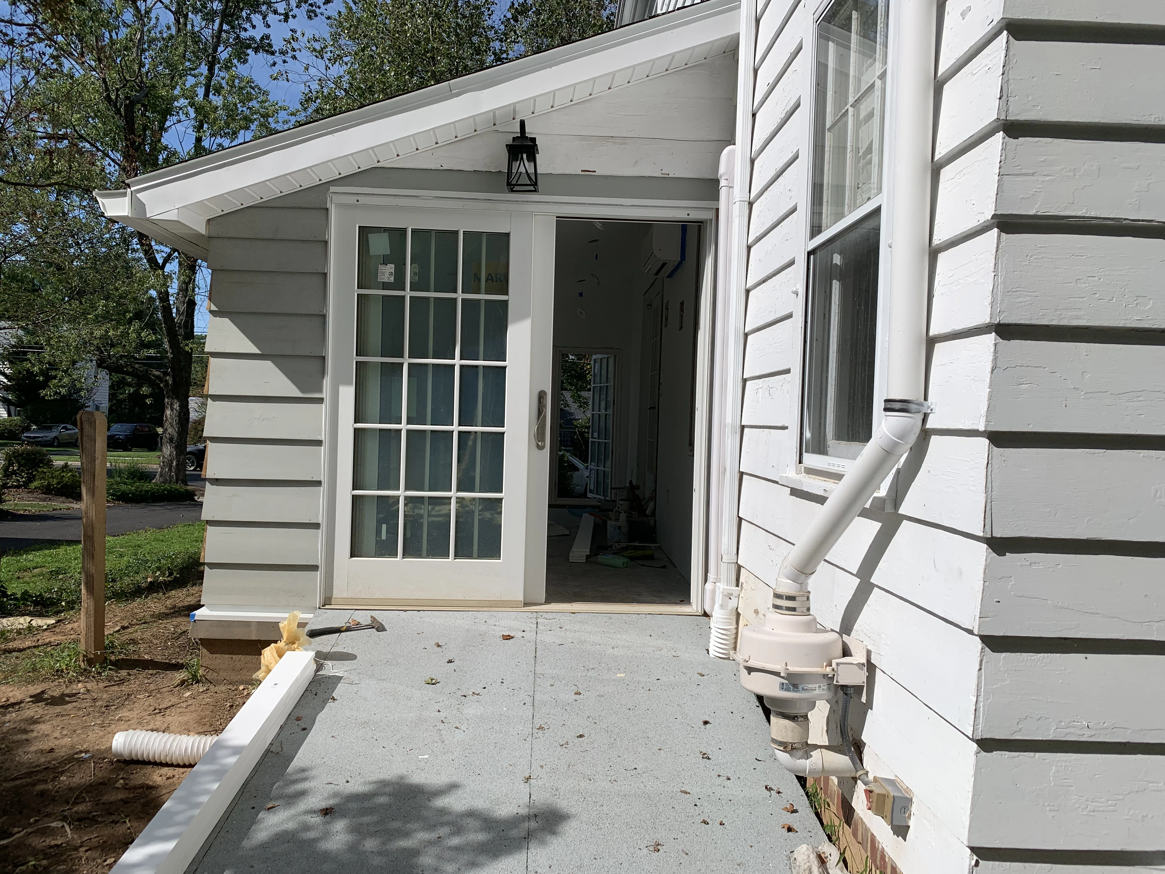A sunroom renovation which includes glass doors plus a ramp for wheelchair and other types of access